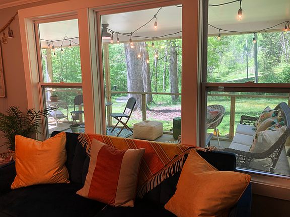 View from living room to screened in porch