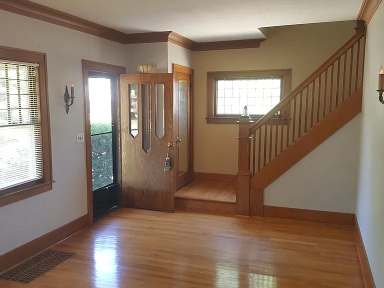Living room and foyer. All hardwood and tile (no carpet) Natural woodwork in great condition.