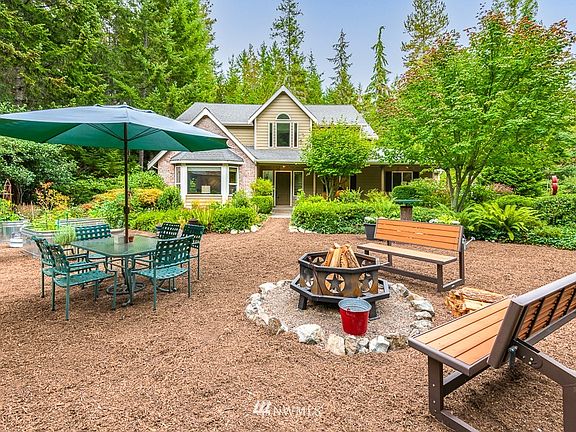 Outdoor entertainment area with firepit.