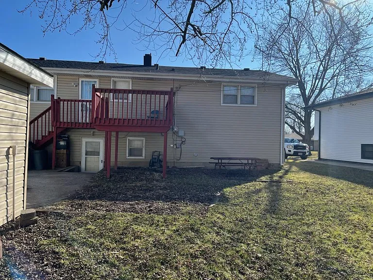 Back yard of the house with deck