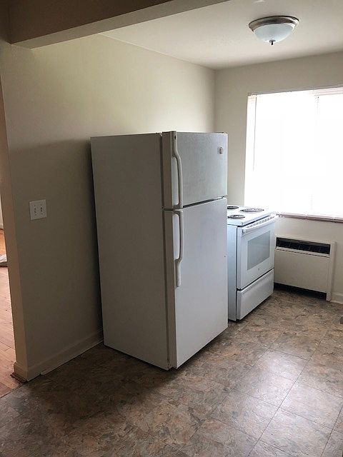 Kitchen with refrigerator and stove