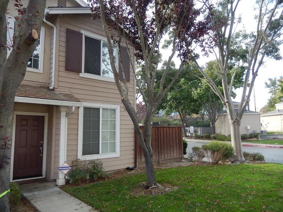 Front elevation with community pool across