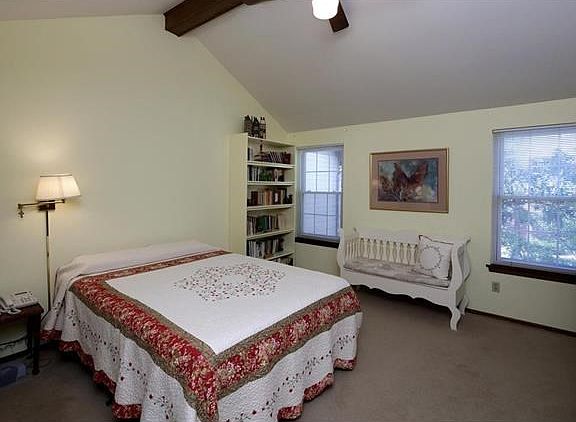 The upstairs master suite has a beamed vaulted ceiling, 2 wall closets and a full bath.