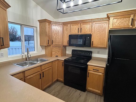 kitchen with new microwave and new refrigerator (delivered after this picture taken.)