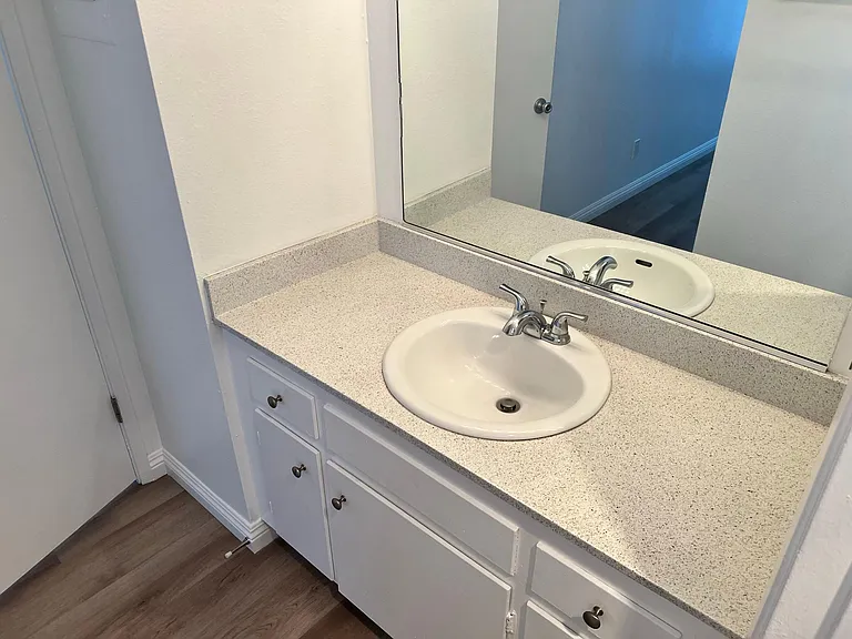 Primary bathroom vanity located inside of the master bedroom residence 2x2