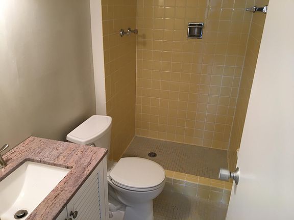 Full bathroom off of main bedroom, with new vanity and commo