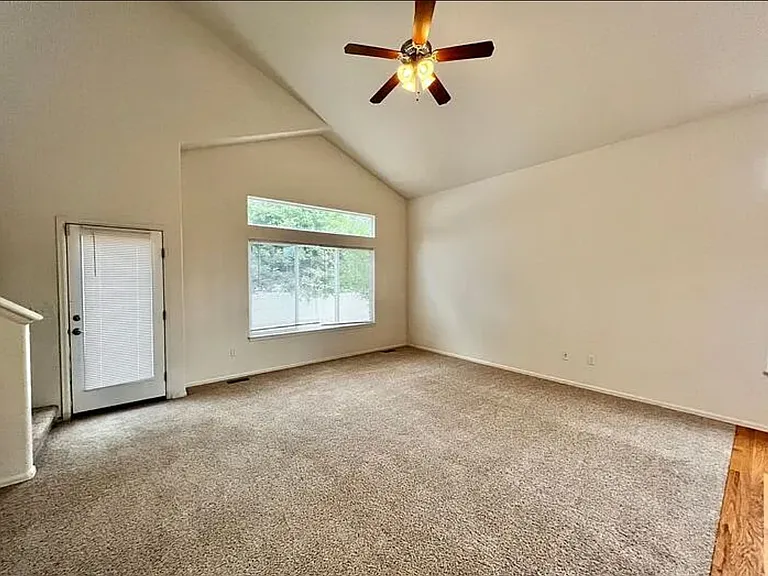 View of the living room from master bedroom archway.