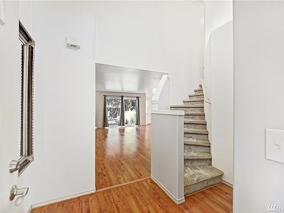 Vaulted clients at the entryway make this home feel large and spacious.