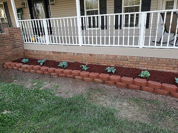 Flower beds in front of hous