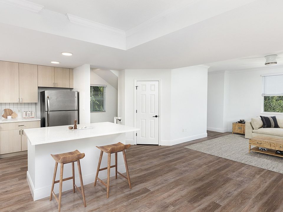 Spacious kitchen with an island that opens up to the living room