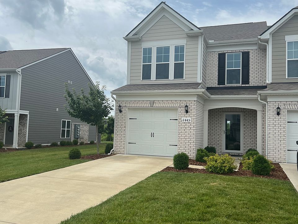 Front and side Yards with 2-car driveway
