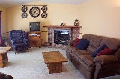 Spacious family room offers a fireplace for cozy evenings.