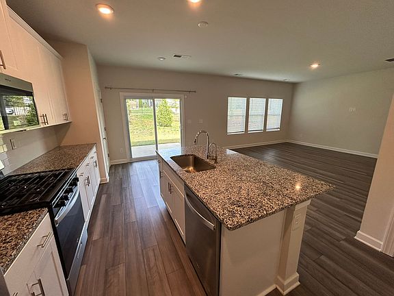Cook while enjoying the open-concept layout _ island faces the living room and patio