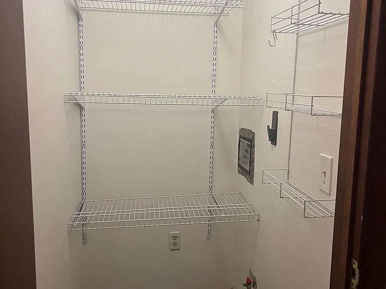 indoor utility room with washer/dryer hookups or storage area
