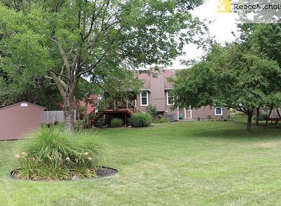 Beautiful landscaped backyard with storage shed/play house