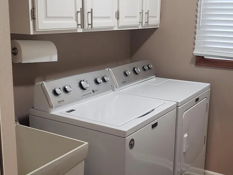 Washer and Dryer with laundry tub.