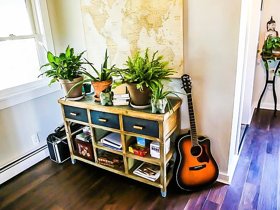 Simple Joys: Games, a guitar, and cozy decor - unwind and feel at home.