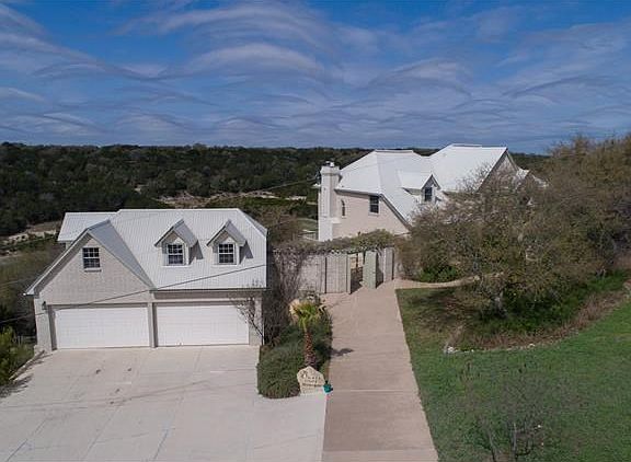Oversized 4 car garage with decked storage above