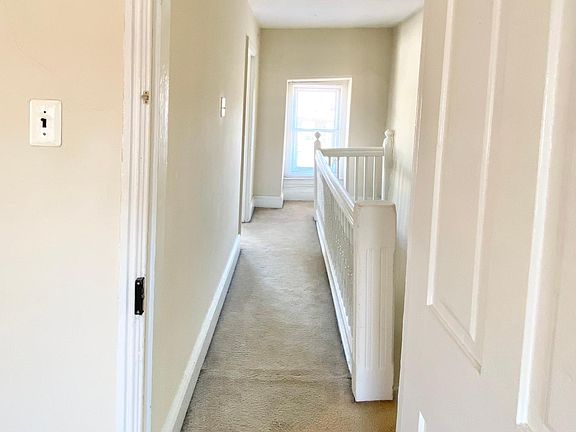 Upstairs hallway. Doorway to second bedroom is on the far left.