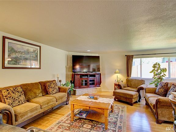 Living room with Gas Fireplace behind TV stand
