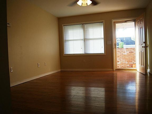 Front door with glass screen door brings in the natural ligh