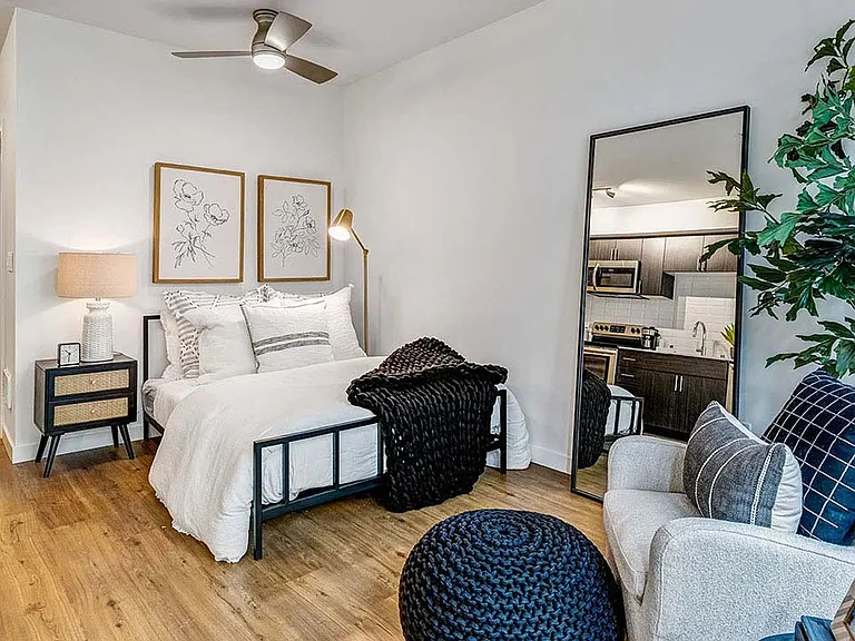 Griffis Shoreline studio apartment living area with wood style floor.