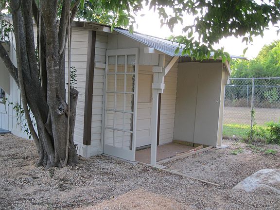 side with covered patio