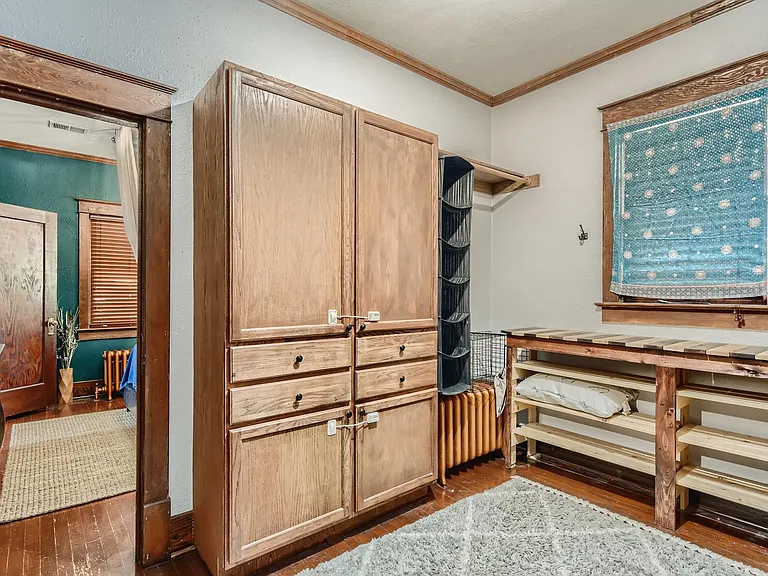 Large walk-in dressing room and closet with plenty of storage.