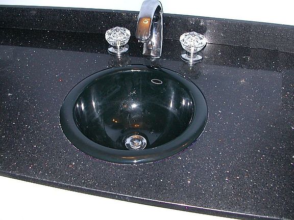 "Stellar Night" Silestone bath counter has sparkling bits of recycled mirror 
