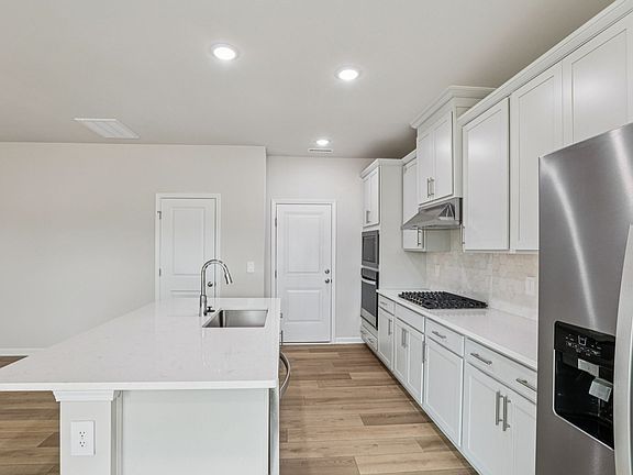 Kitchen in the Dallas floorplan at a Meritage Homes community in Garner, NC.