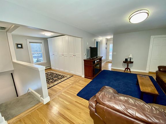 2nd Floor Living area, and stairs to 1st Floor Bedroom and Front Door