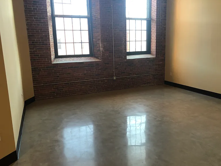 Apt 310 sitting room. Concrete floors with radiant heat, throughout.