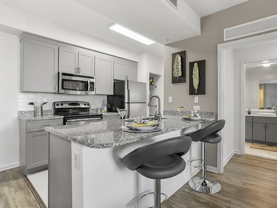 Renovated I Kitchen and dining area with granite countertops