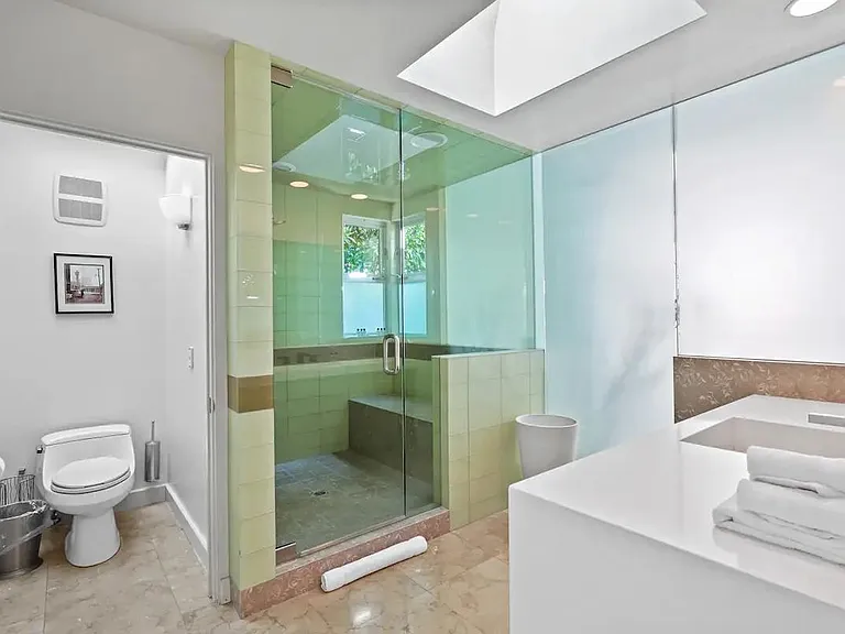 Rejuvenate in the spacious steam shower, offering a luxurious and indulgent experience.