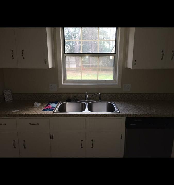 Kitchen overlooking backyard