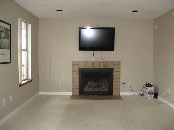 Comfortable Family Room with recessed lighting.