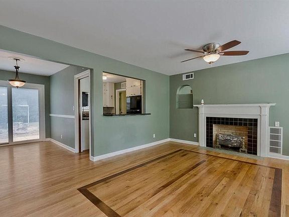 Living room and dinning room.  Notice the great hard floors!