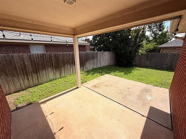 BACK PATIO-EXTENDED AND COVERED.