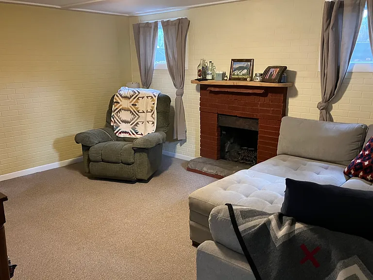 living room *(NOTE: fireplace can only be used with candles/ candelabras at this time)