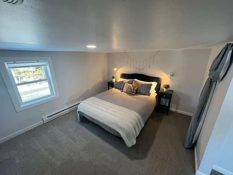 The queen bedroom is spacious and comfortable
