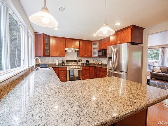 Another view of the kitchen showing the breakfast bar and all of your prepping space. 