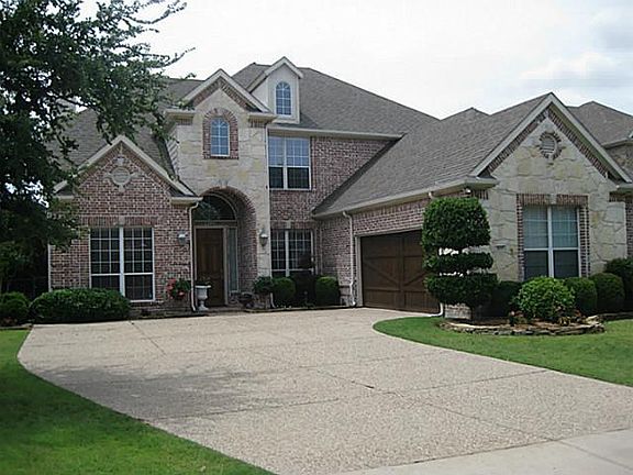 Beautiful Stone & Brick with Swing Entry Garage