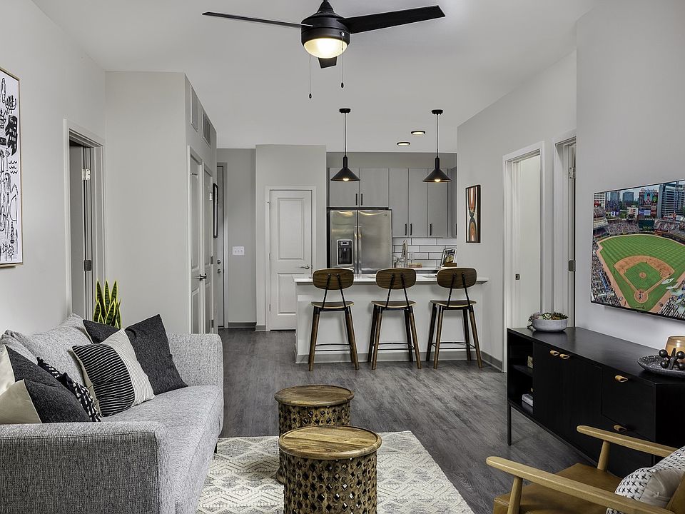 Kitchens are complete with a counter-height bar and quartz countertops.