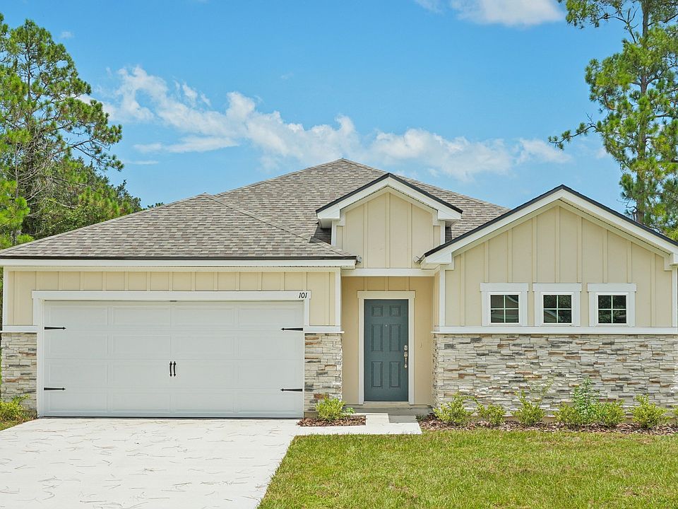 Experience elegant simplicity with a striking gabled roof and pristine landscaping in Palm Coast.