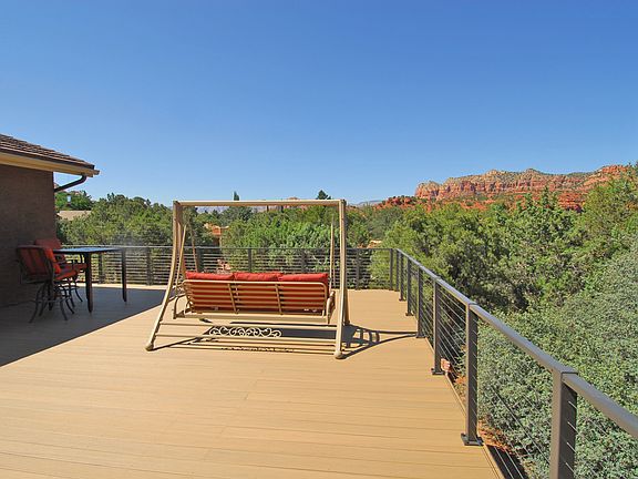Spacious deck with lots of outdoor seating.