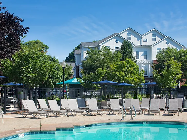 Swimming pool and sundeck with lounge seating