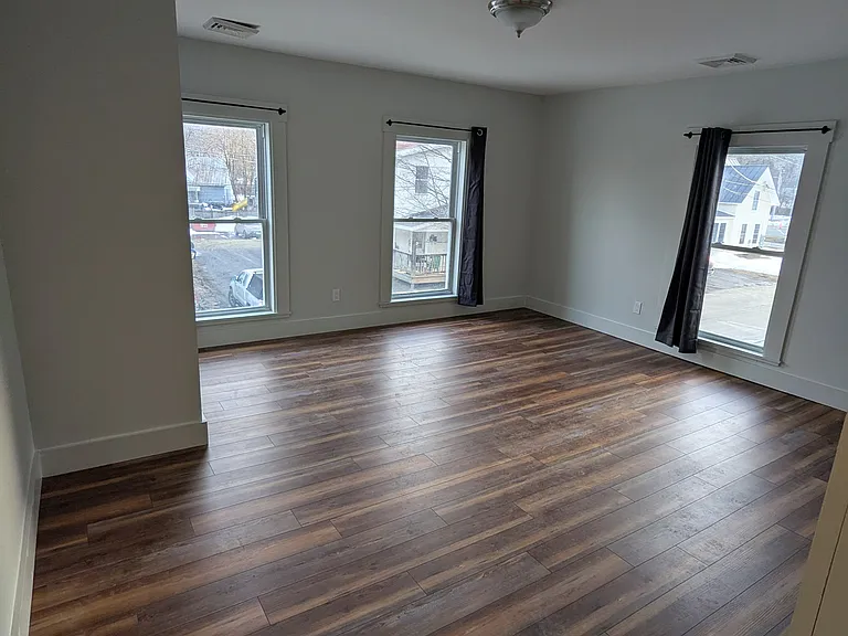 Living Room with three floor-to-ceiling windows.