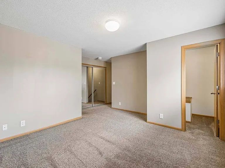 A spacious bedroom with soft natural light and generous proportions offers a peaceful retreat at the end of every day.