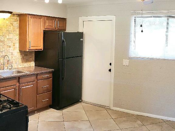 kitchen has back door for easy access to parking