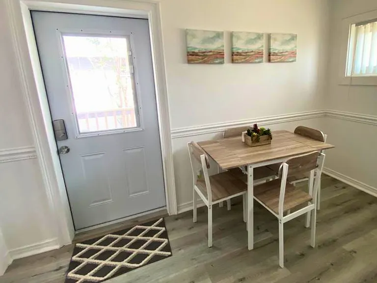 Cozy 4-seat dining area with a beautiful centerpiece, perfect for memorable meals.